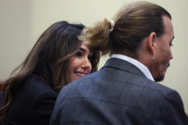 Camille Wask (left) and Johnny Depp (right) chatted and laughed in a court full of gibberish.  (European news agency)