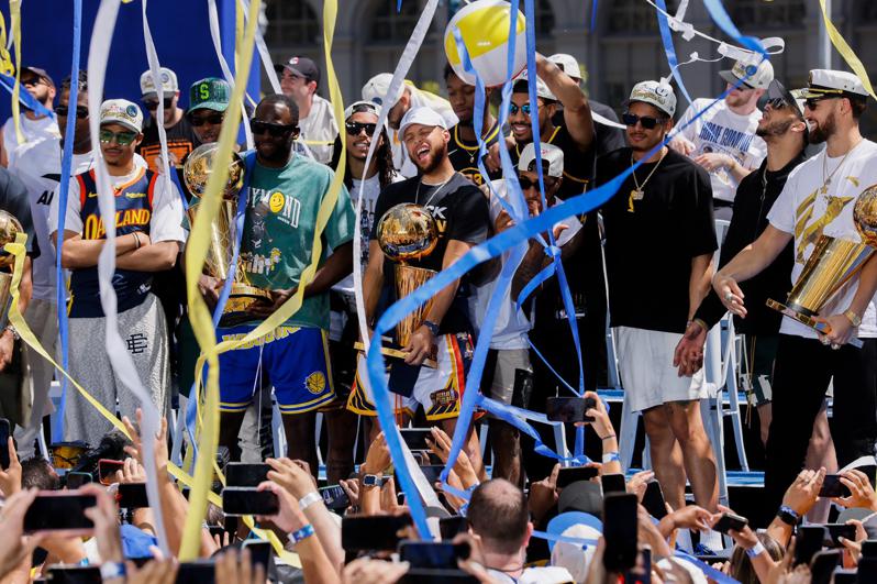 The Warriors won the championship parade, and streamers were thrown out to celebrate with the masses.  (The Associated Press)
